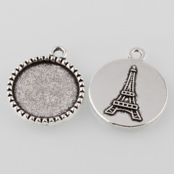 Support de cabochon rond et plat avec tour Eiffel à l'arrière en décor. Couleur argent antique