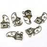 Breloque cage avec oiseau et volute bronze
